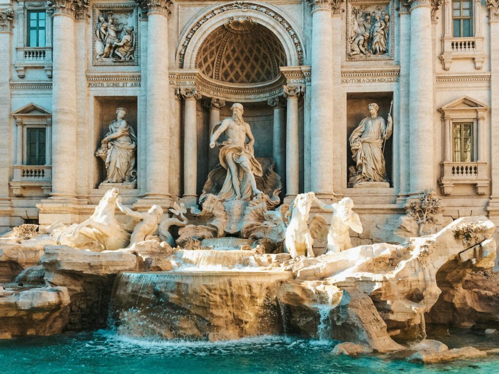 Stunning daytime capture of the iconic Trevi Fountain in Rome, showcasing its intricate Baroque sculptures.